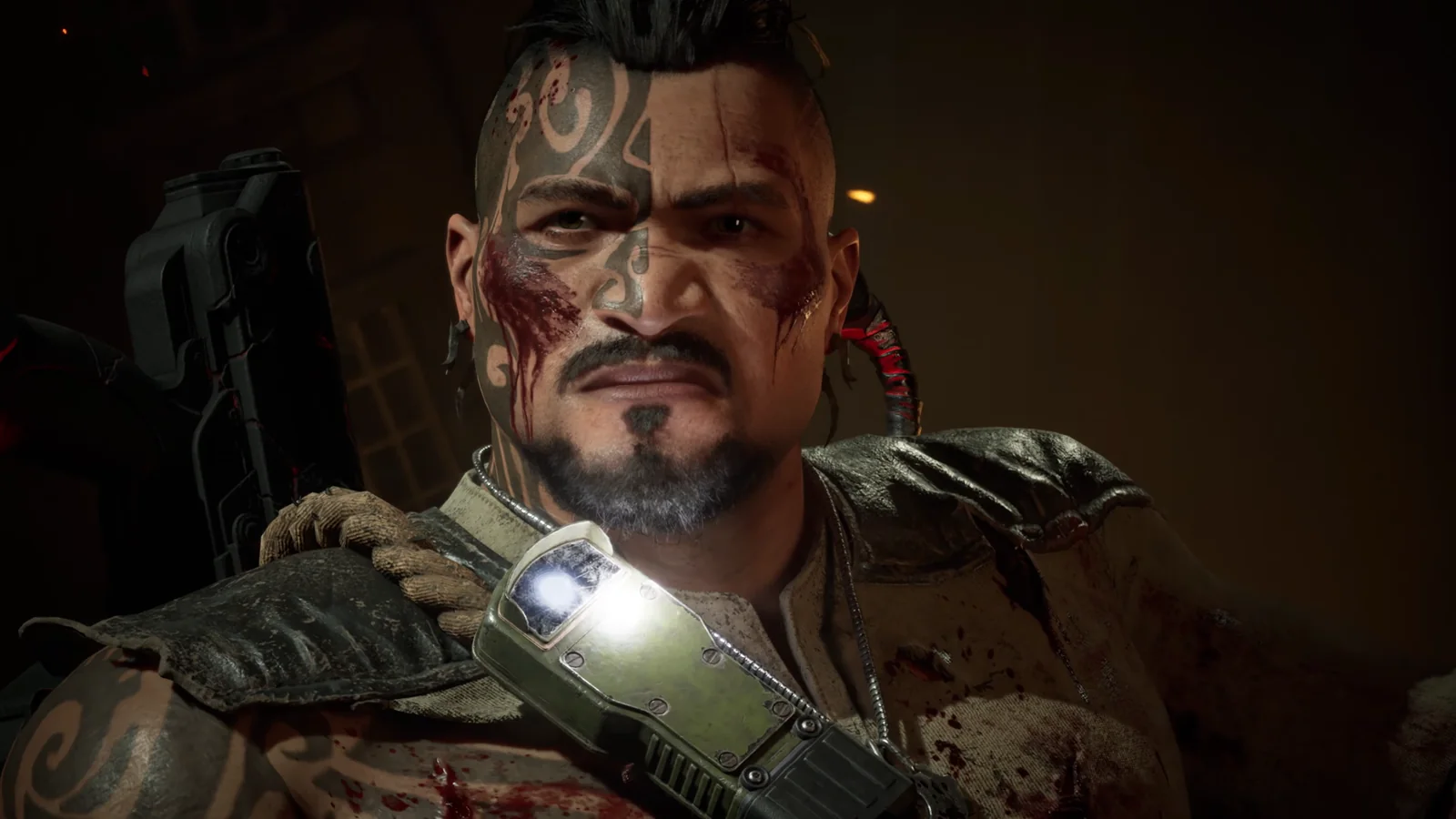 Primer plano de Tai Kaliso con los tatuajes tribales en el rostro, salpicado de sangre, mirando fijamente en Gears of War: E-Day