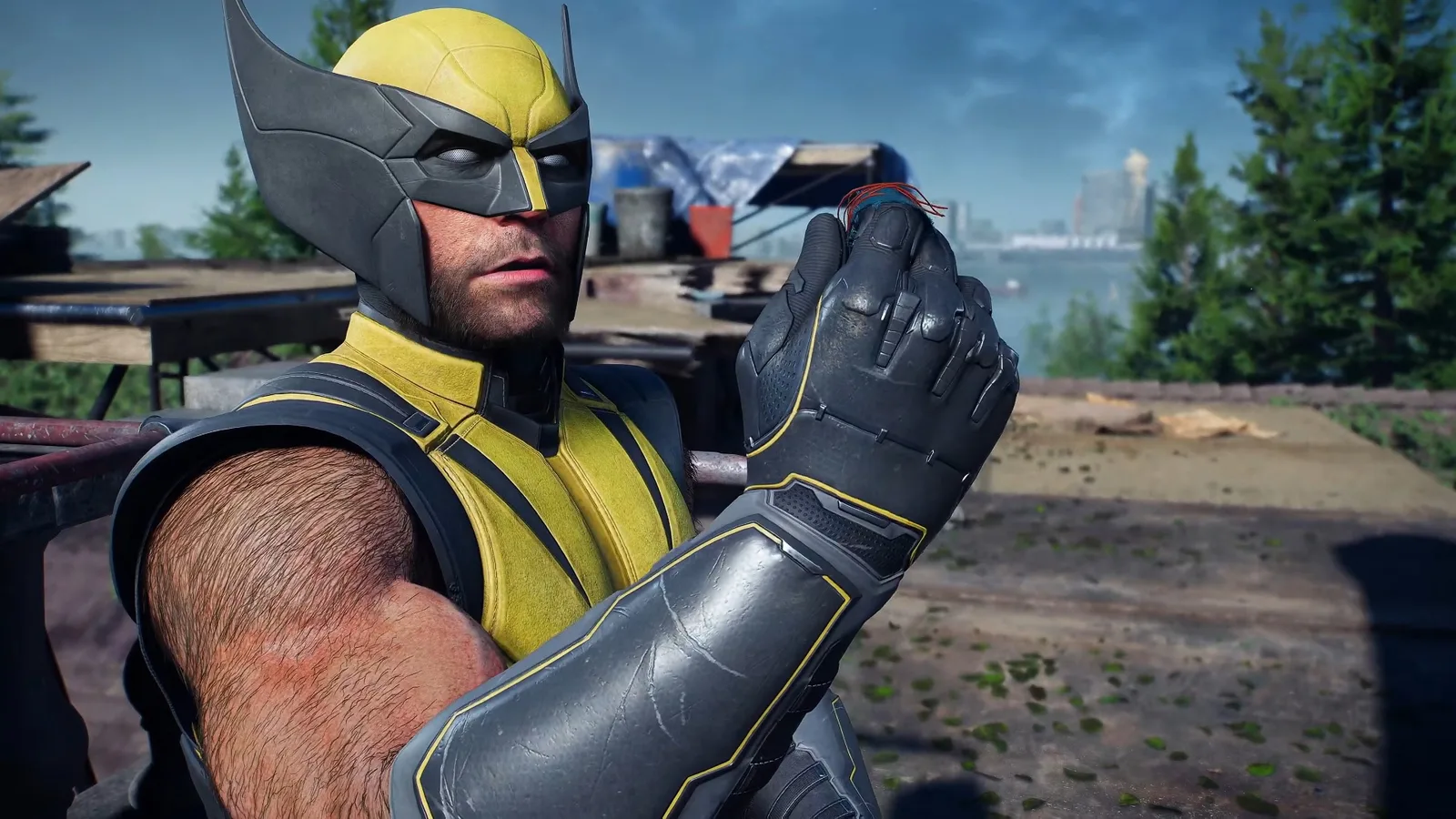 Logan con el traje amarillo y negro clásico de Wolverine en una escena de gameplay de Marvel's Wolverine