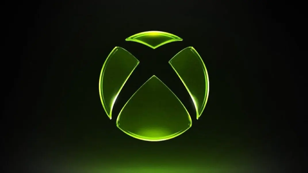 Logo de Xbox iluminado en verde sobre fondo oscuro